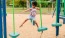 a girl playing on a playground